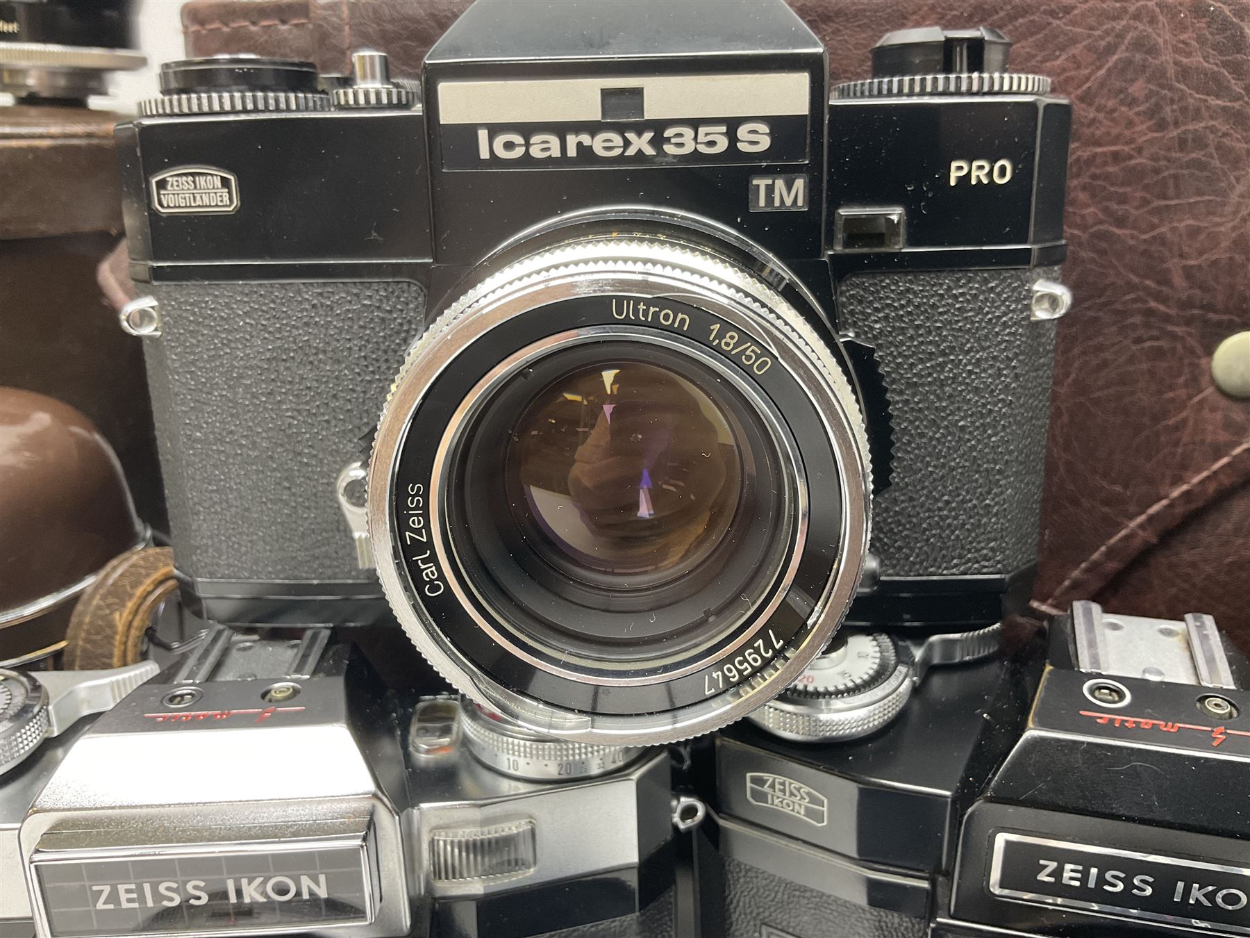 Four Zeiss Ikon camera bodies, to include, Contaflex Super B camera body, serial no. B31591, with 'Carl Zeiss Tessar 2.8/50 lens, serial no.3425553, Contaflex Super BC camera body, serial no. P81728, with 'Carl Zeiss Tessar 2.8/50' lens, serial no 4822280, etc, together with three cased lenses; 'Carl Zeiss Pro-Tessar 1:4 f=115mm' lens, serial no 3734740, 'Carl Zeiss Pr-Tessar 1:3.2 f=85mm' lens, serial no. 3647764 and 'Carl Zeiss Pr-Tessar 1:3.2 f=35mm' lens, and other Zeiss Ikon equipment 