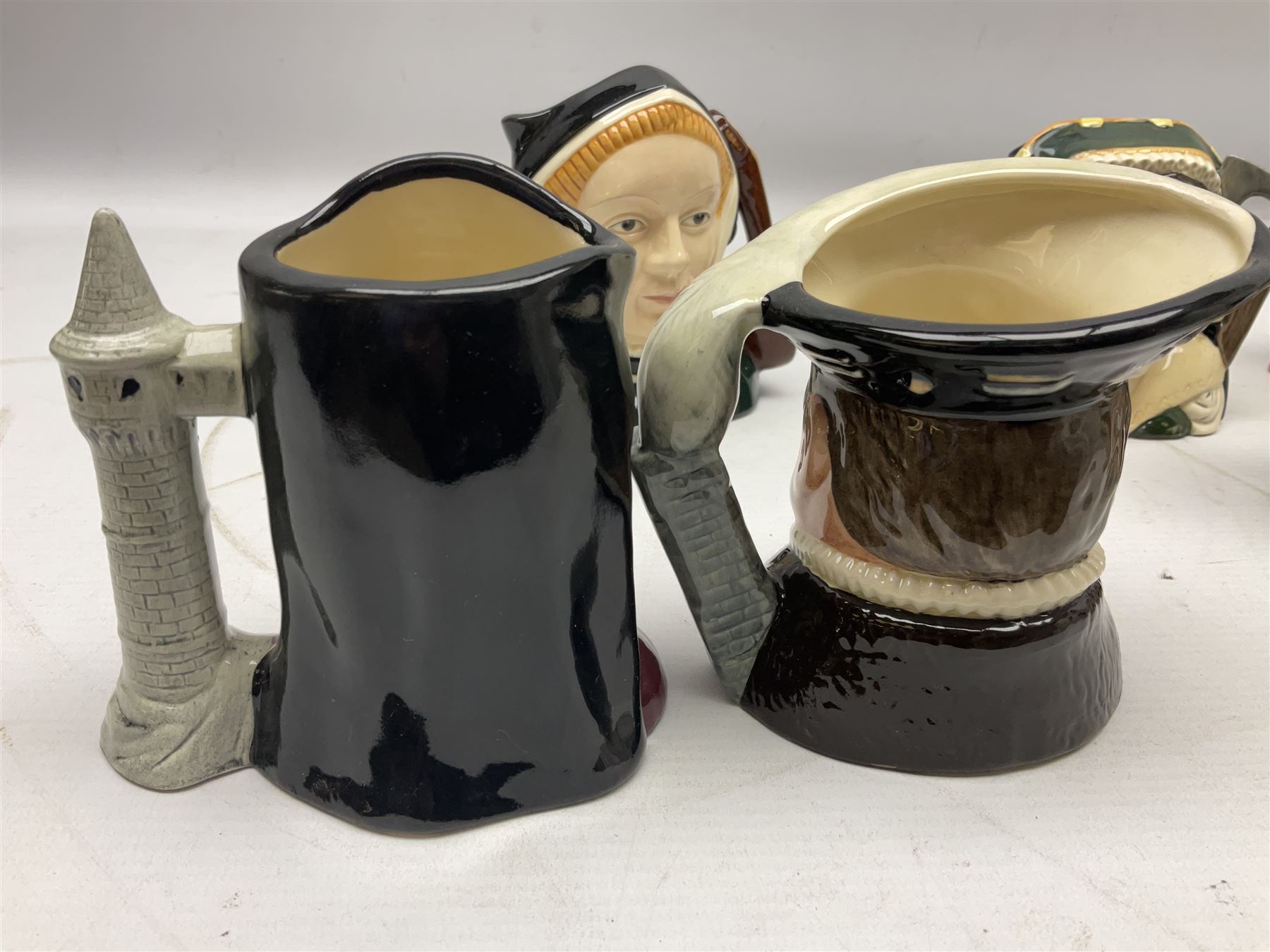 Royal Doulton Henry VIII and his Six Wives Character Jugs, comprising of Henry VIII D6647, Catherine of Aragon D6657, Anne Boleyn D6650, Jane Seymour D6746, Anne of Cleves D6753, Catherine Howard D6692 and Catherine Parr D6751, tallest H10cm