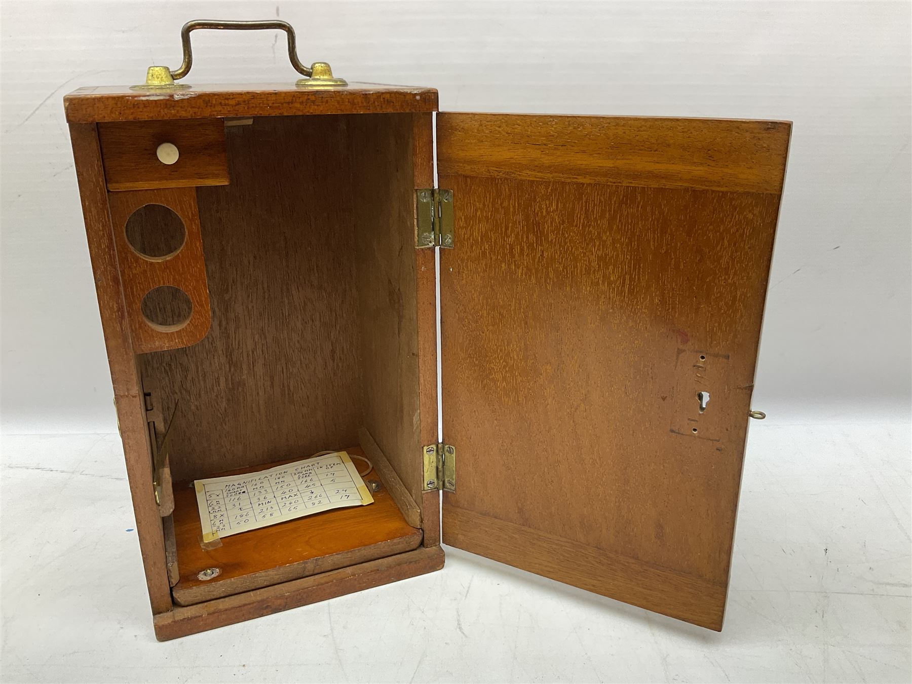  Brass field microscope, together with a cased microscope and twenty five microscope slides