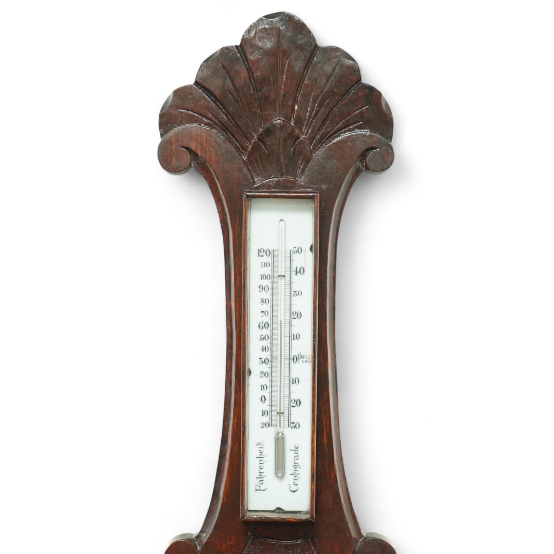Early 20th-century aneroid barometer with an 8-inch ceramic dial, signed Negretti & Zambra, in a carved oak case, featuring a mercury thermometer
