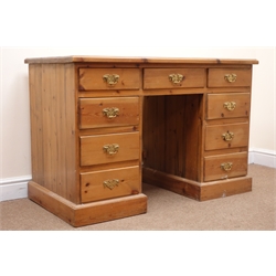  Mid century pine twin pedestal desk, nine drawers, plinth base, W115cm, H77cm, D60cm  