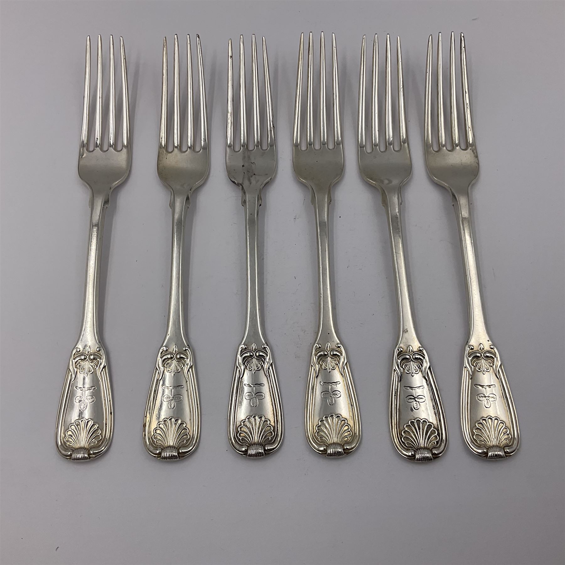 George IV Scottish silver Kings pattern cutlery for six place settings, to include table spoons, table forks, dessert spoons and dessert forks, all engraved with shamrock crest to terminal, hallmarked Robert Gray & Son, Glasgow 1833