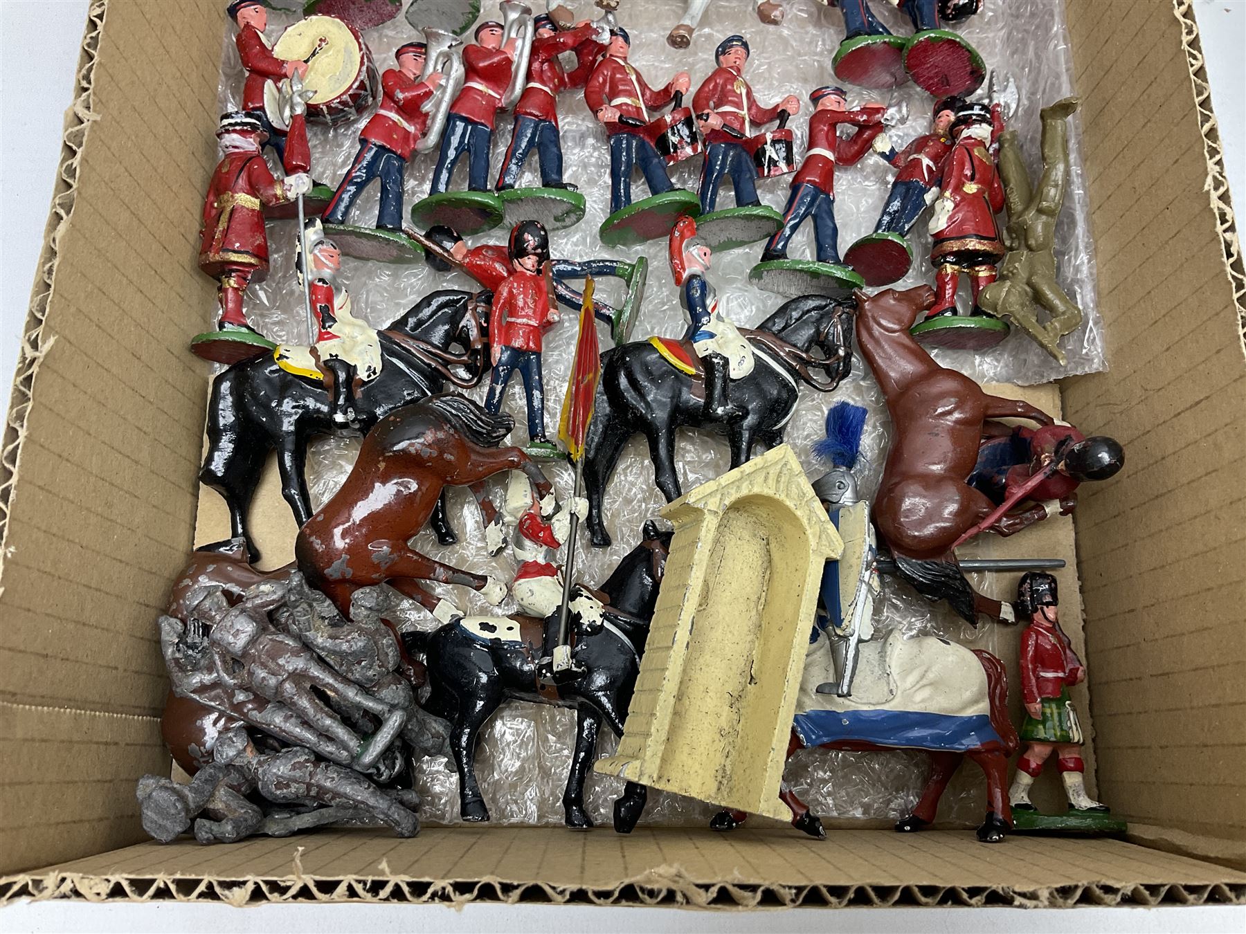 Sectional wooden fort on base with painted textured finish 46 x 36cm; together with over thirty lead and die-cast white metal soldiers and horses by various makers; and a small quantity of plastic figures of soldiers