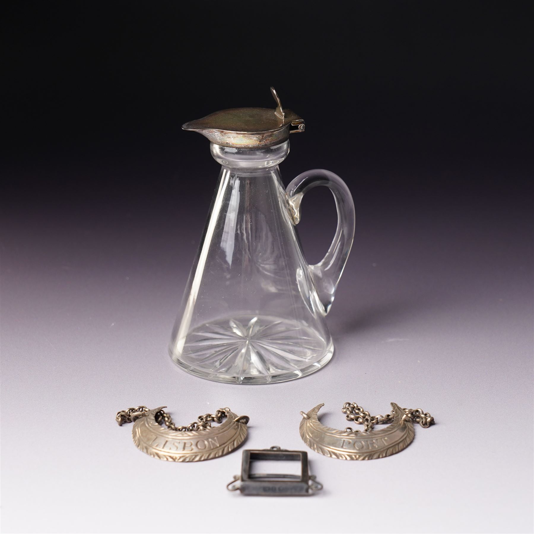 Glass whisky noggin with silver hinged cover and clear glass handle H10cm Birmingham 1921 Maker Hukin & Heath, a pair of early silver decanter labels 'Lisbon' and 'Port' and a small silver frame 