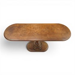 Georgian mahogany console table, the top of oval form, above a turn vasiform column, above an oval plinth base 