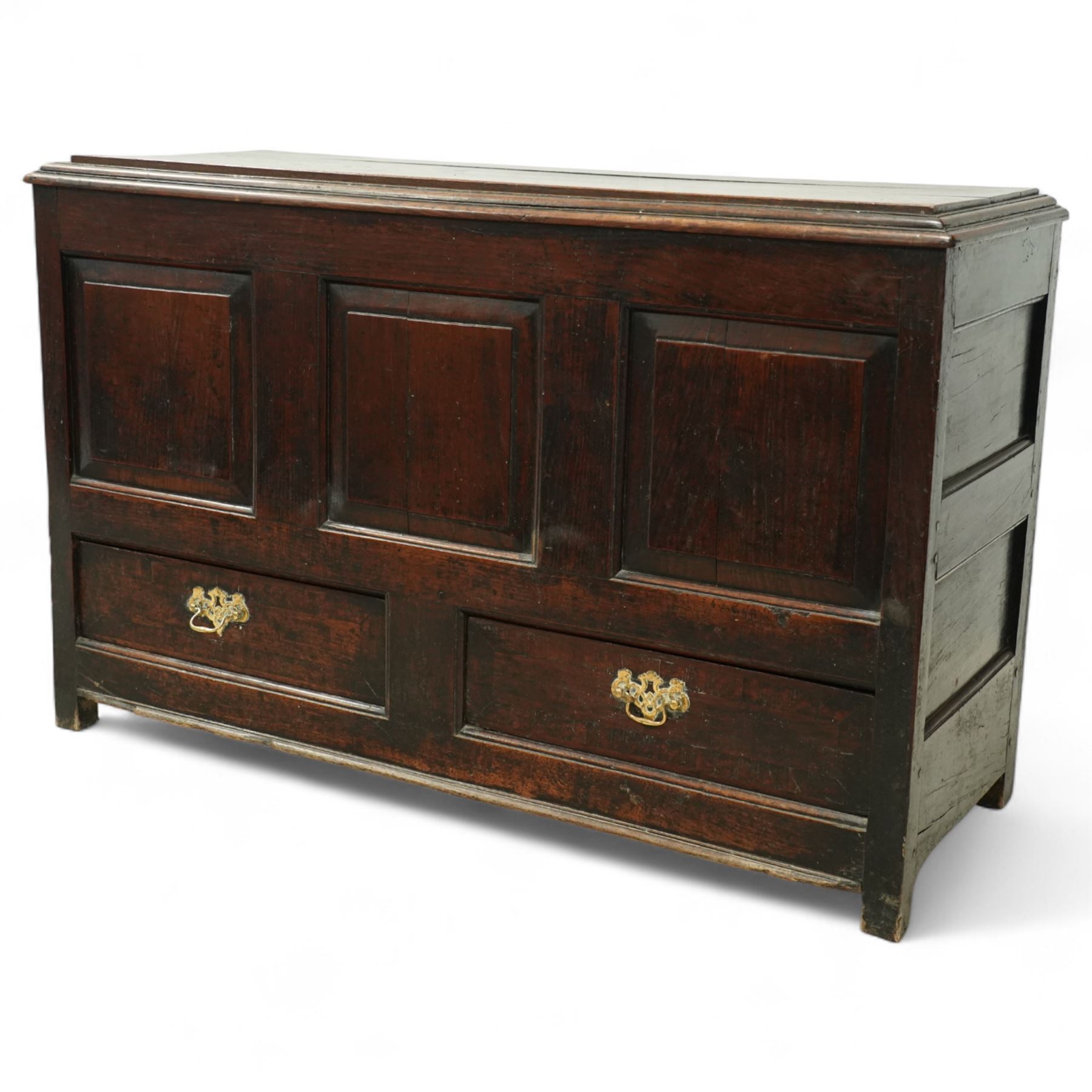 19th century oak coffer, the hinged plank top above a panelled front fitted with two drawers to base, raised on bracket feet