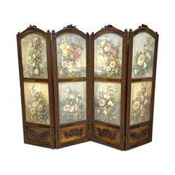 Victorian walnut framed four panel folding screen, the pediments in the form of rose flower heads with extending leafage and flanked by foliate finials, the eight glazed panels containing still life watercolours of floral compositions and rose bushes, above figured walnut panels with applied carved garlands and ribbons, within a border of incised overlapping shell motifs