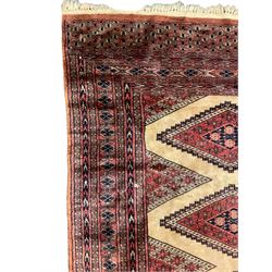 Persian rug, the interconnecting field decorated with four lozenge medallions, multiple band border with overall geometric design decorated with stylised flower head motifs