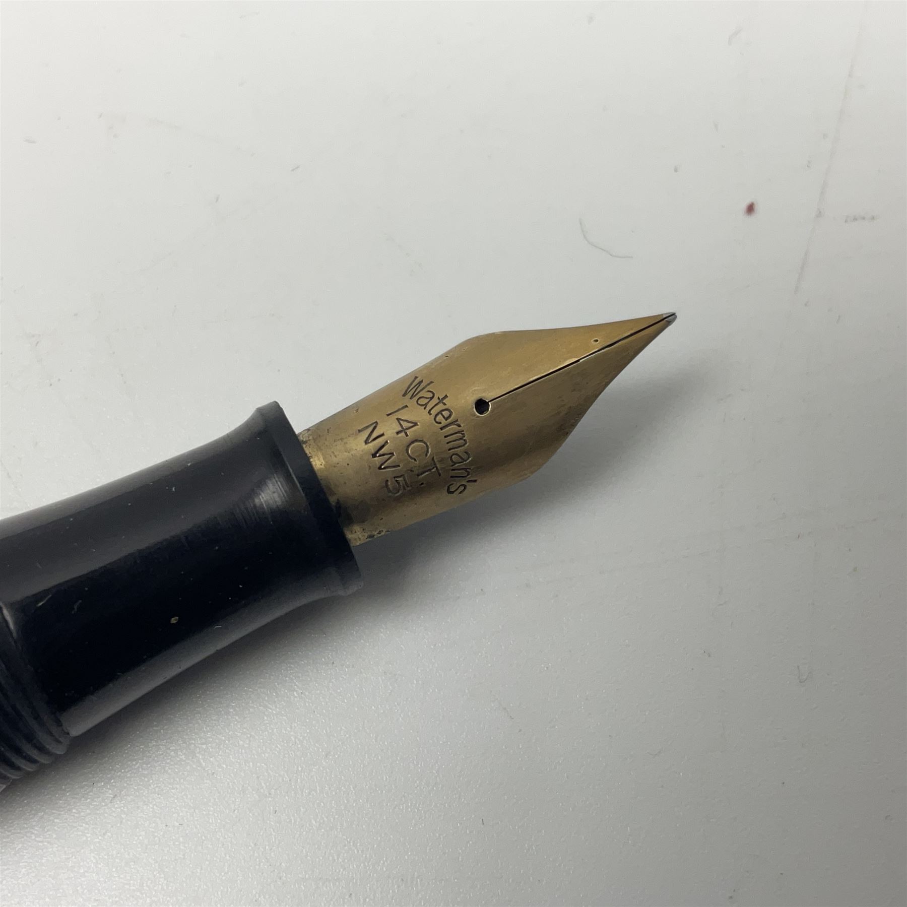 Four fountain pens, each with 14ct gold nibs, comprising Mentmore Paramount, Parker Junior Duofold, Conway Stewart marbleised pen and Waterman's, together with a 14ct gold Conway Stewart 5B nib