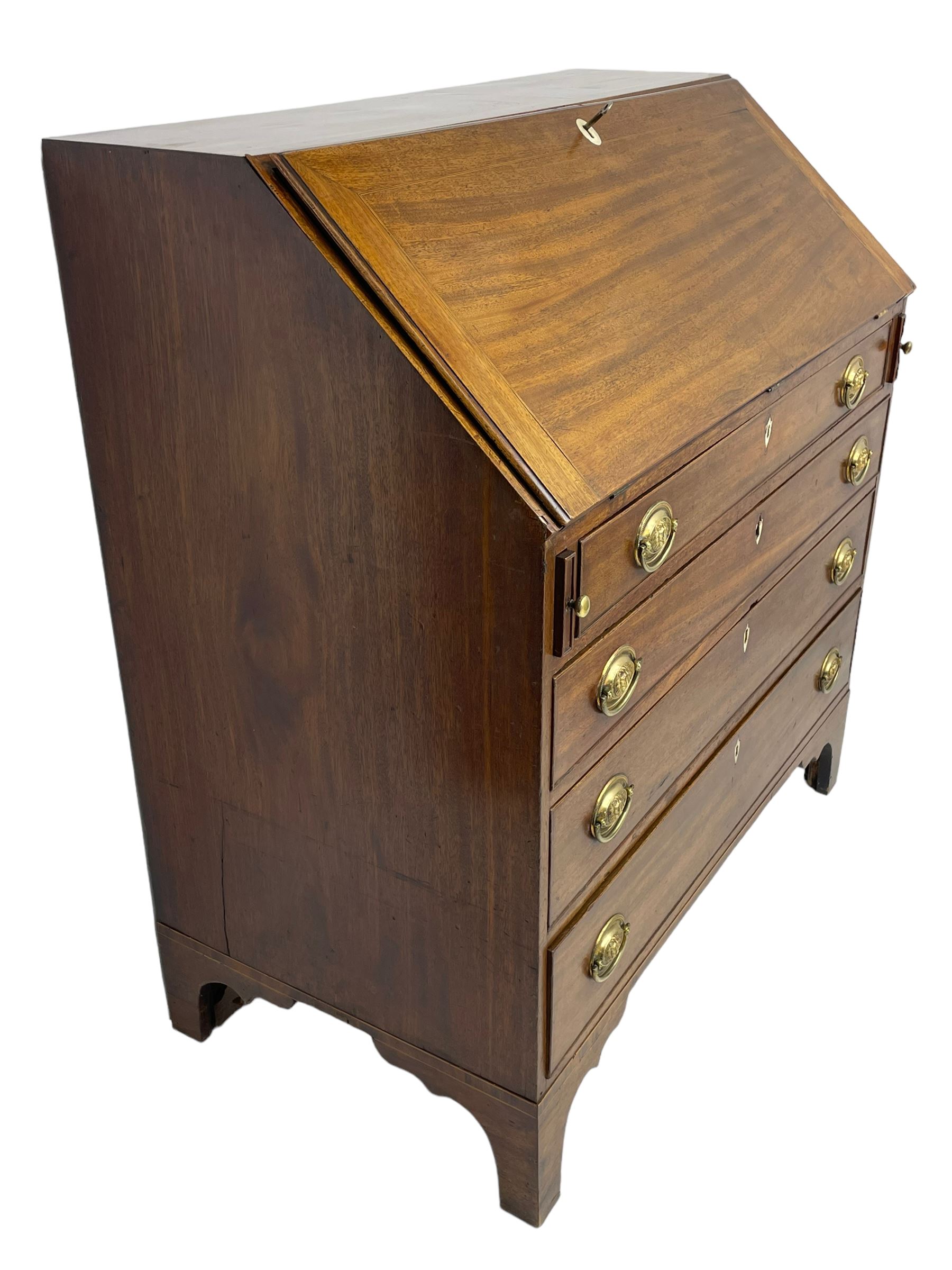 George III mahogany bureau, the fall-front banded and with boxwood stringing, enclosing fitted interior with pigeonholes and drawers surrounding a central cupboard with inlaid shell motif, the base with four graduating cock-beaded drawers, each with pressed brass handle plates with central lion masks and ivory escutcheons, on shaped bracket feet
This item has been registered for sale under Section 10 of the APHA Ivory Act