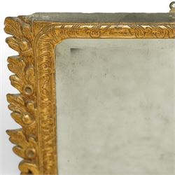 19th century George III style giltwood overmantel mirror, the rectangular bevelled plate within a moulded frame decorated with acanthus leaf and floral scroll carving to the corners, and sides flanked by two girandole sockets 