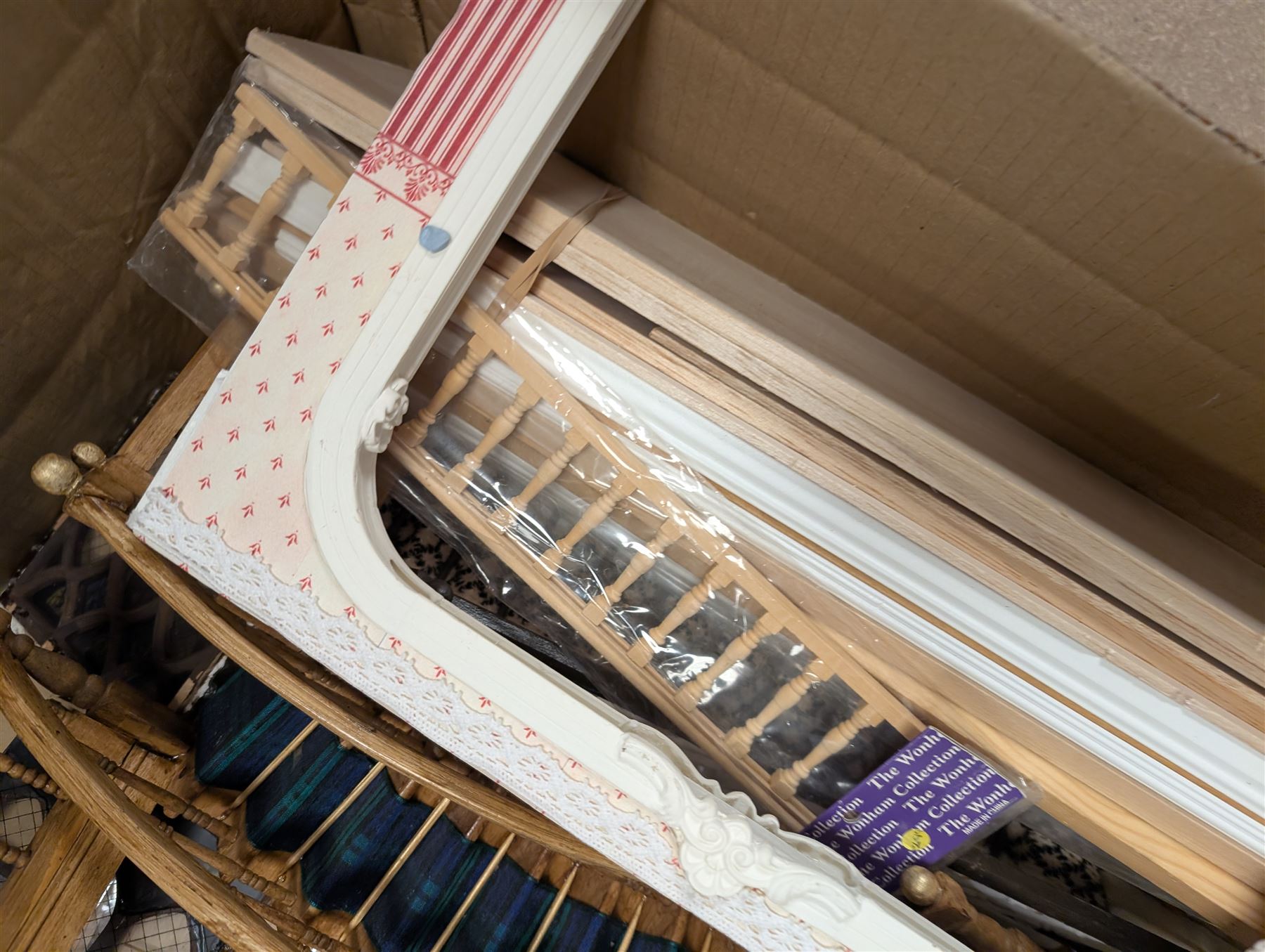 Dolls House building accessories, including three stair cases, a quantity of doors and windows, skirting board, coving, kitchen and fireplaces scenes and a collection of wired and non wired light fittings