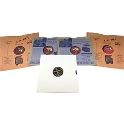 HMV portable wind up gramophone in a black case, together with a collection of records. 