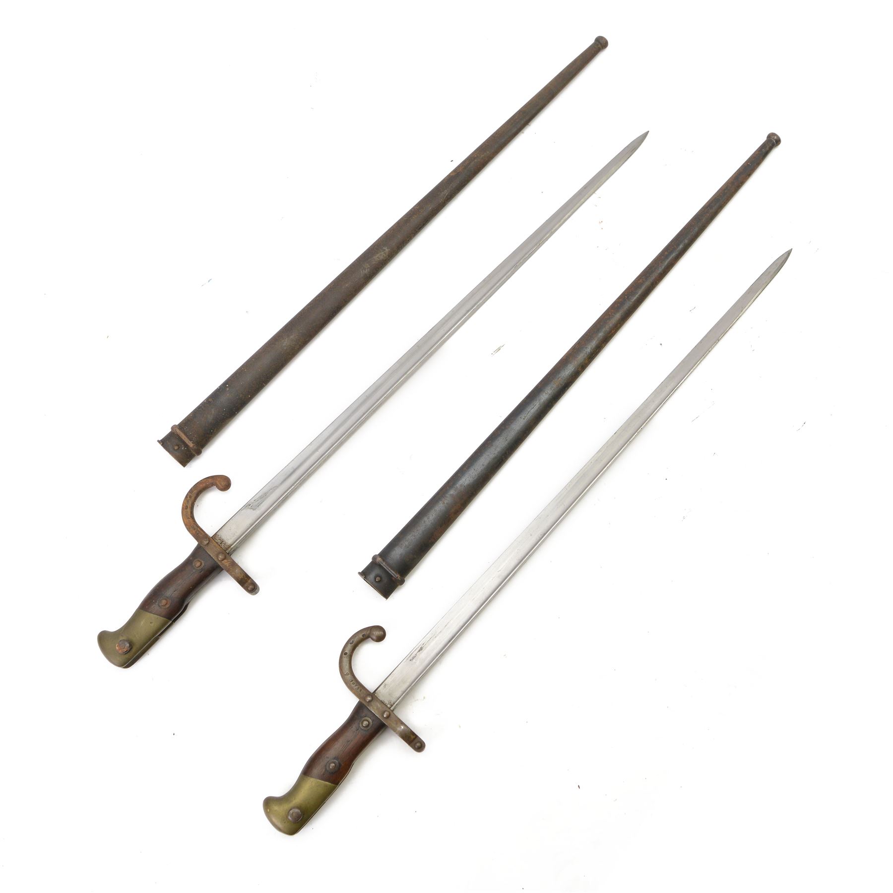 French chassepot bayonet the spine engraved St. Etienne, Mass 1876, with matching scabbard and another French chassepot engraved 1877, with matching scabbard 