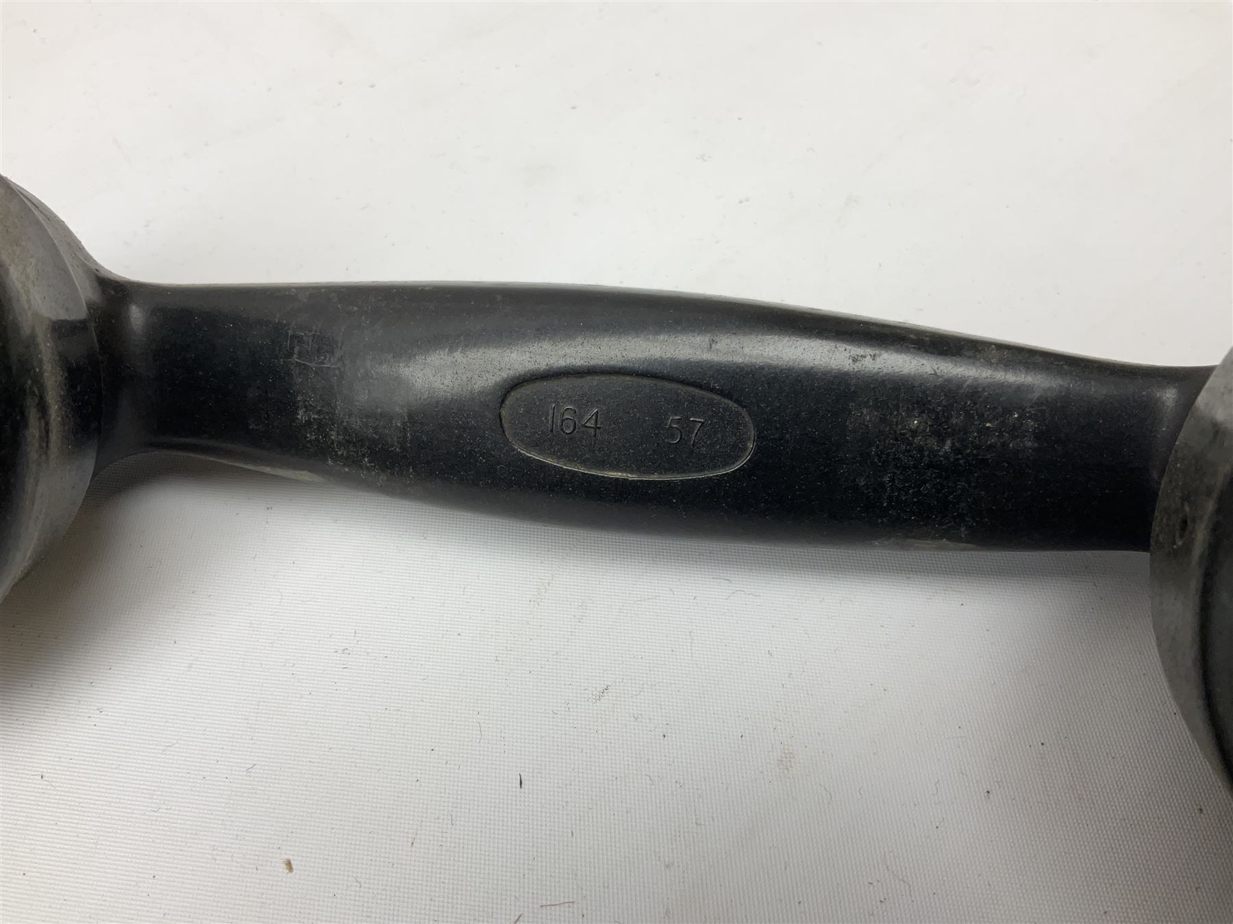 Early-mid 20th century internal telephone system, comprising exchange box with attached TMC rotary telephone and dictograph with Bakelite handset and support upon stained wood case, and 1960s black Bakelite telephone model 312L with G.P.O sticker beneath, largest H30.5cm W36.5cm D30cm