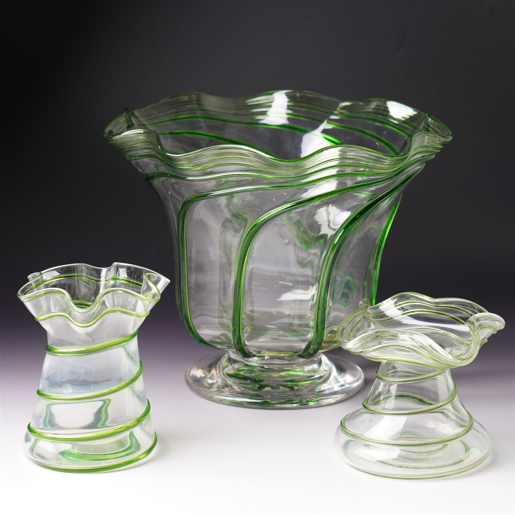 Three early 20th century glass vases, attributed to Stuart and Sons of Stourbridge, each with green glass art nouveau spiral decoration, largest H18cm (3)