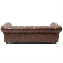 Miniature brown leather button back Chesterfield sofa, with castors 