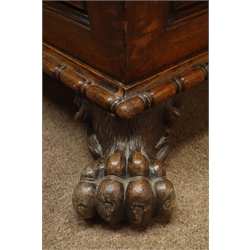  19th century oak sarcophacus shaped cellarette, with geometric moulded panels and gadrooned moulded base on four hairy paw feet with recessed brass castors, inset lead liner, W86cm, H55cm, D57cm  