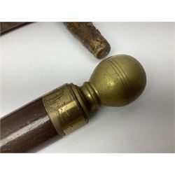 Four wooden walking canes, including a carved mahogany snooker cue example, tallest H86cm