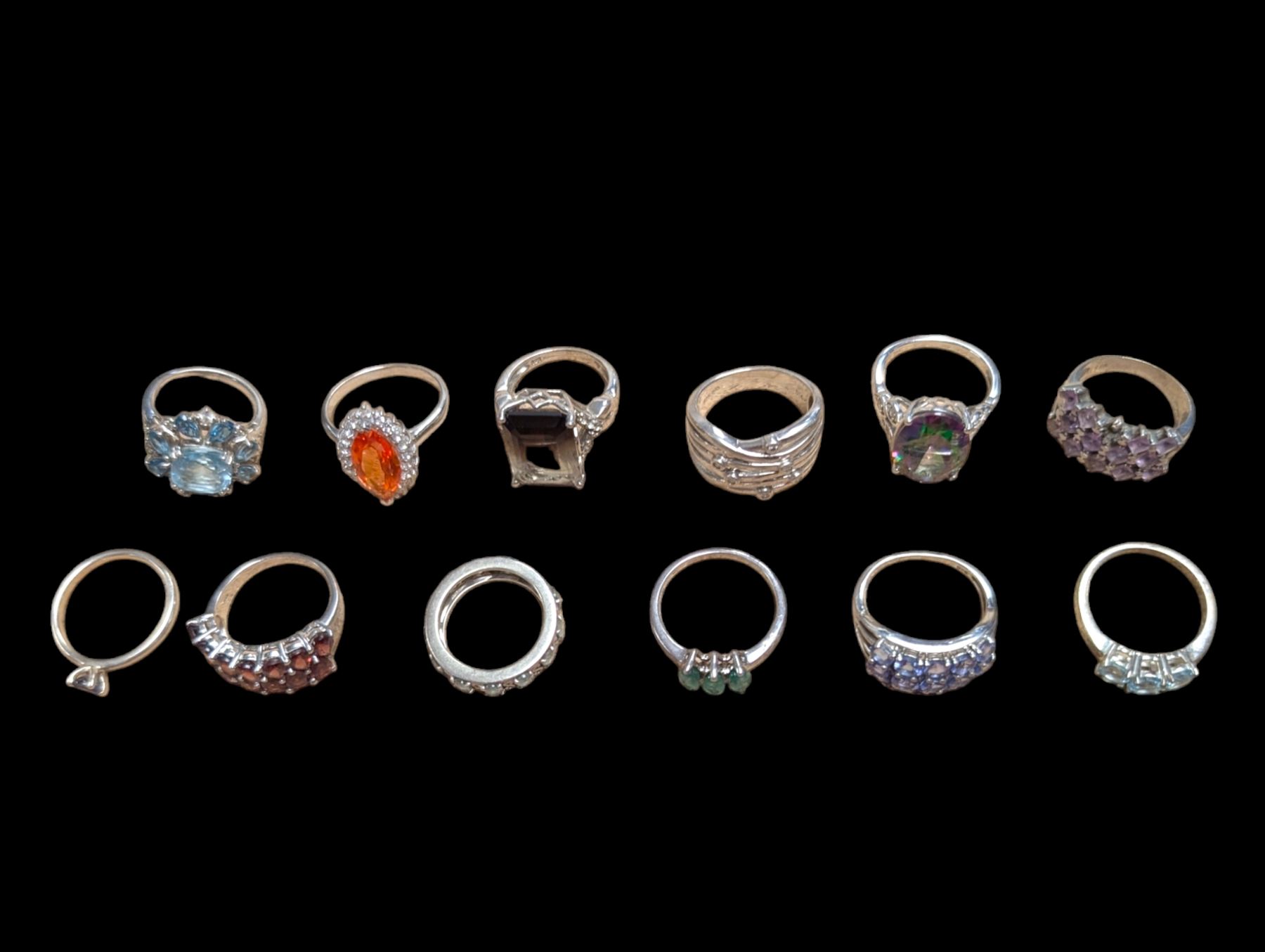 Twelve silver stone set rings
