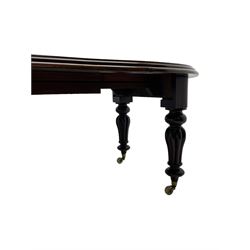 Victorian mahogany extending dining table, circular telescopic extending top with moulded edge, two additional leaves, on turned and lobe carved supports with brass and ceramic castors 