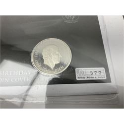 Queen Elizabeth II 2000 'The Queen Mother' silver proof five pound coin, 2000 'Millennium' silver proof five pounds, 2007 'Scouts' silver proof fifty pence, Tristan Da Cunha 2014 9ct gold 1 gram gold one crown coin, all cased with certificates and a 'Prince Charles 60th Birthday Commemorative Coin Cover' containing a 2008 silver proof five pound coin in folder (5)