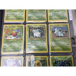 Collection of Pokemon trading cards, mostly 1999 Wizards Pokemon cards to include holo Charizard 4/102, first edition holo Machamp 8/102, further holographic cards; Dark Flareon 35/82 and Dark Vaporeon 45/82, cards from themed sets and 4th edition prints; 1998 Electronic Pokédex with cardboard boxes for themed decks Blackout, Overgrowth and Power Reserve Jungle, along with a large quantity of energy and trainer cards 
