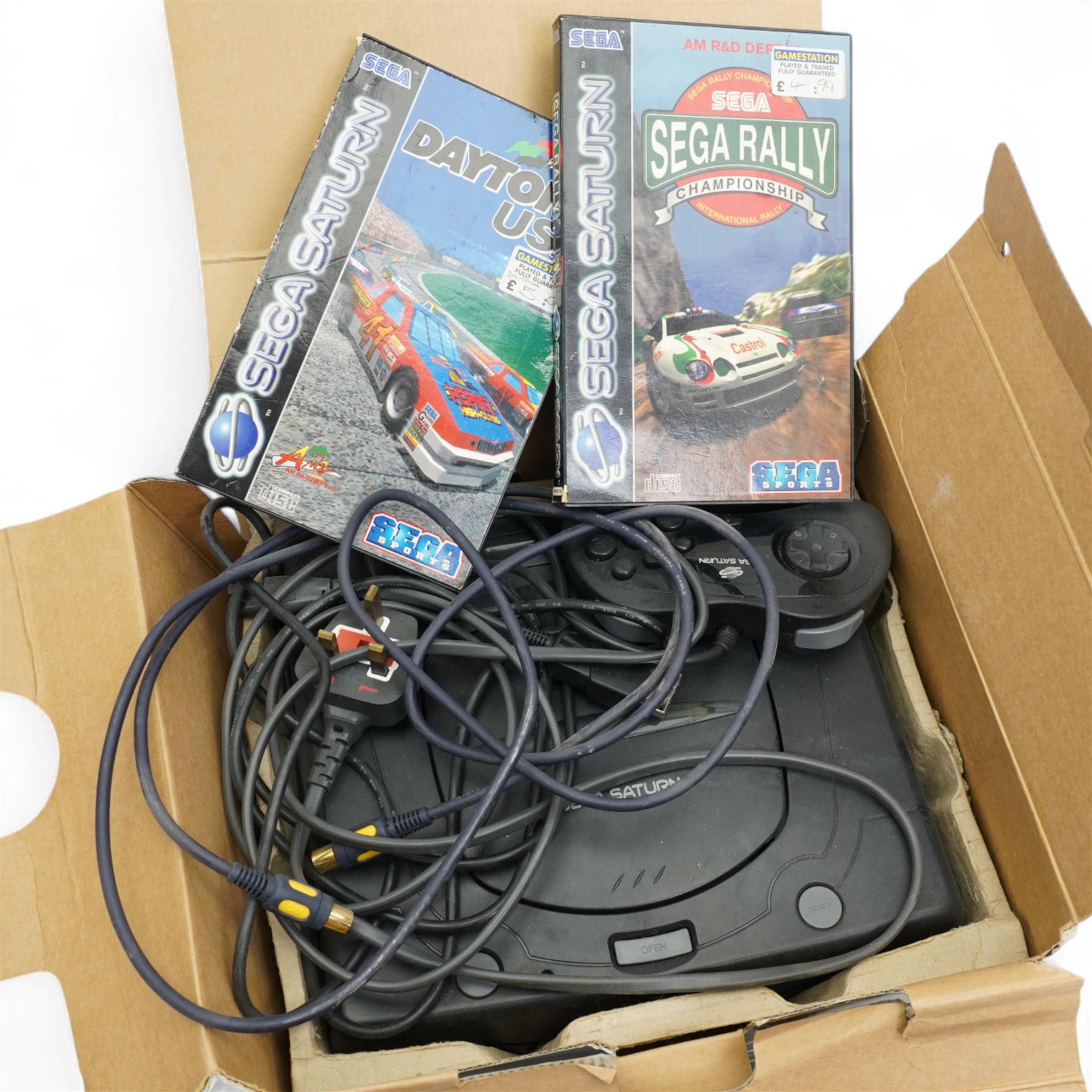 Sega Saturn games console, boxed with two games 'Daytona USA' and 'Sega Rally Championships'