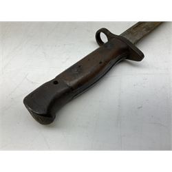British Pattern 1907 bayonet with 43.5cm fullered steel blade; in leather scabbard with webbing frog L58cm overall; another Pattern 1907 bayonet lacking scabbard; and British Pattern 1888 Mk.I bayonet by Wilkinson London (no scabbard) (3)