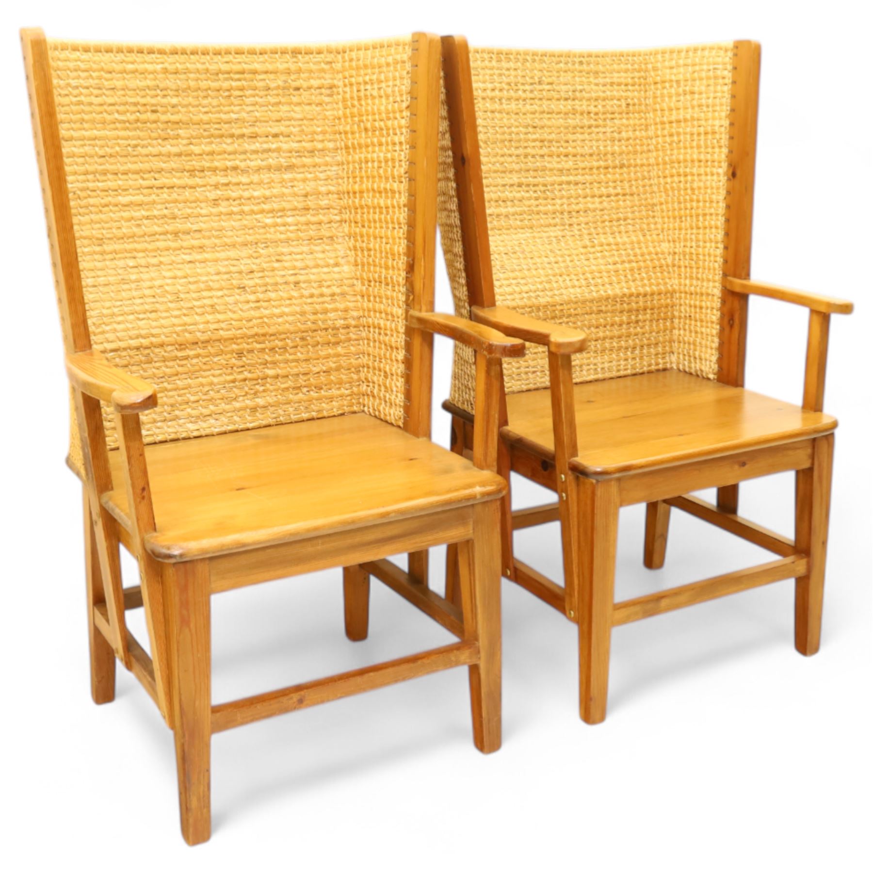 Pair of 20th century full-size pine Orkney chairs, high-back armchairs of traditional design, pegged and wedged construction, wrap-around backrest and sides, above scrolled out-swept arms and solid rounded pine seat, raised on square tapering legs united by stretchers, hand-signed ‘Jackie Miller’ and stamped ‘Orkney’
