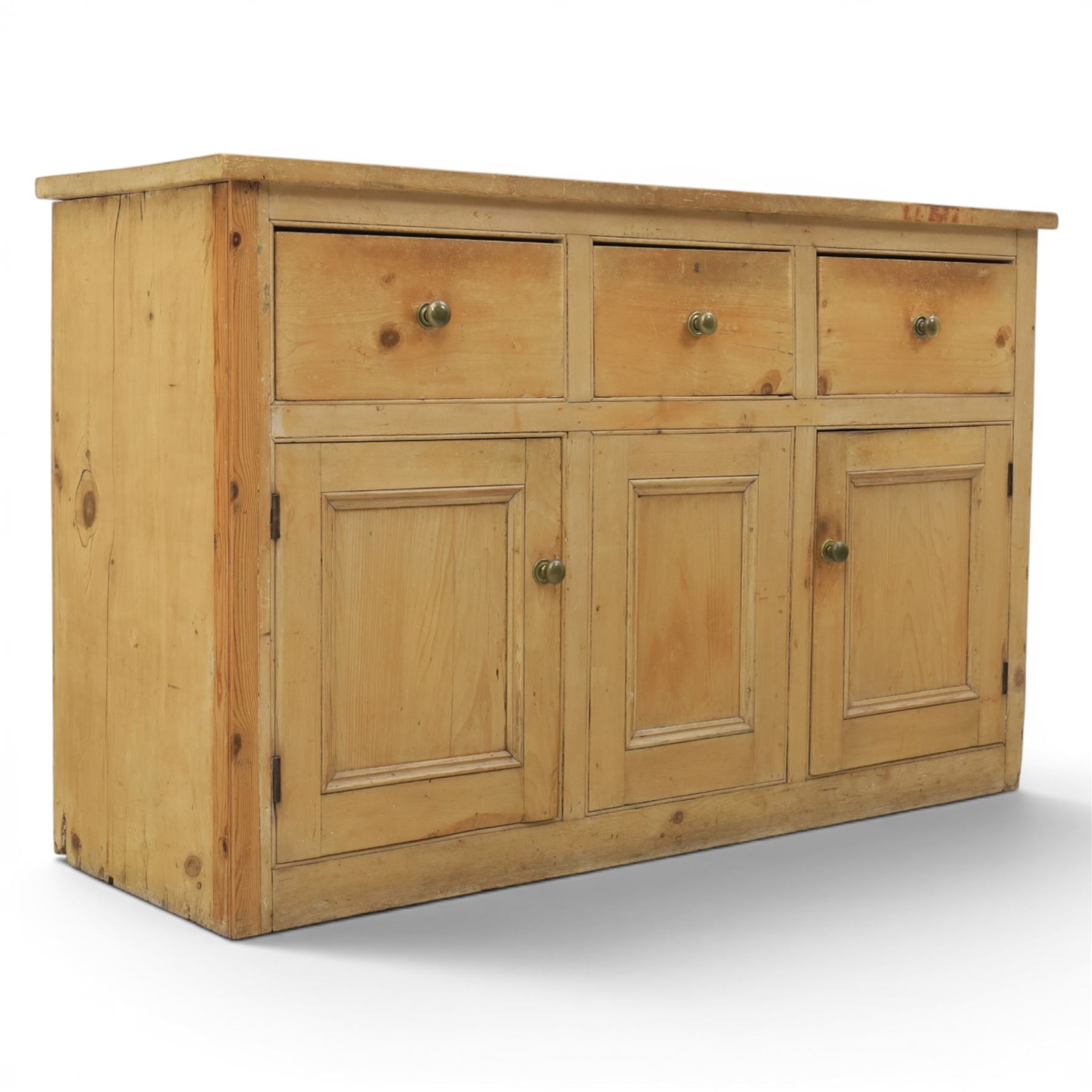 Victorian pine dresser base, with rectangular plank top, above three short drawers over two cupboard doors