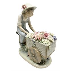 Lladro figure, The Flower Peddler, modelled as boy with a cart of flowers, no 5029, sculpted by Francisco Catala, year issued 1980, year retired 1985, H26cm