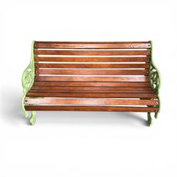 Pair of Victorian design cast iron and slatted wooden garden benches, the ornate pierced end supports of scrolled form, the pierced acanthus leaves interspersed with trailing flowerheads, with tassels to the front, raised on splayed feet, the supports in pale sage green painted finish
