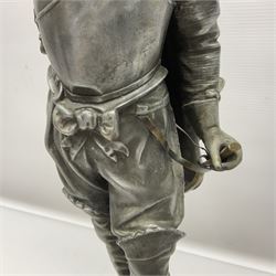 Spelter figure modeled as Cavalier with a raised sword, upon a circular base, H52cm