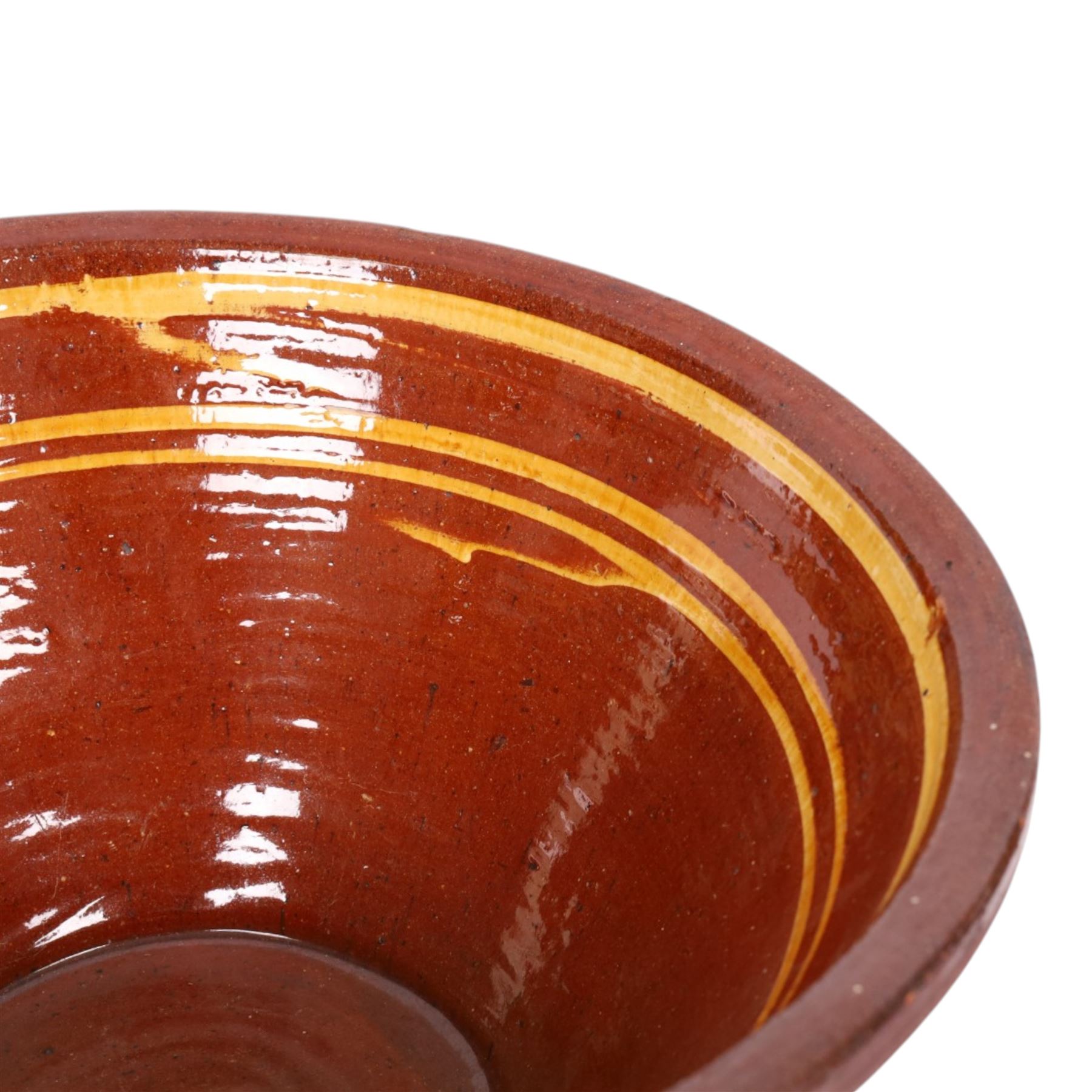 19th century terracotta bread pancheon, of circular form, the glazed interior with slip decoration, H21cm, D43cm