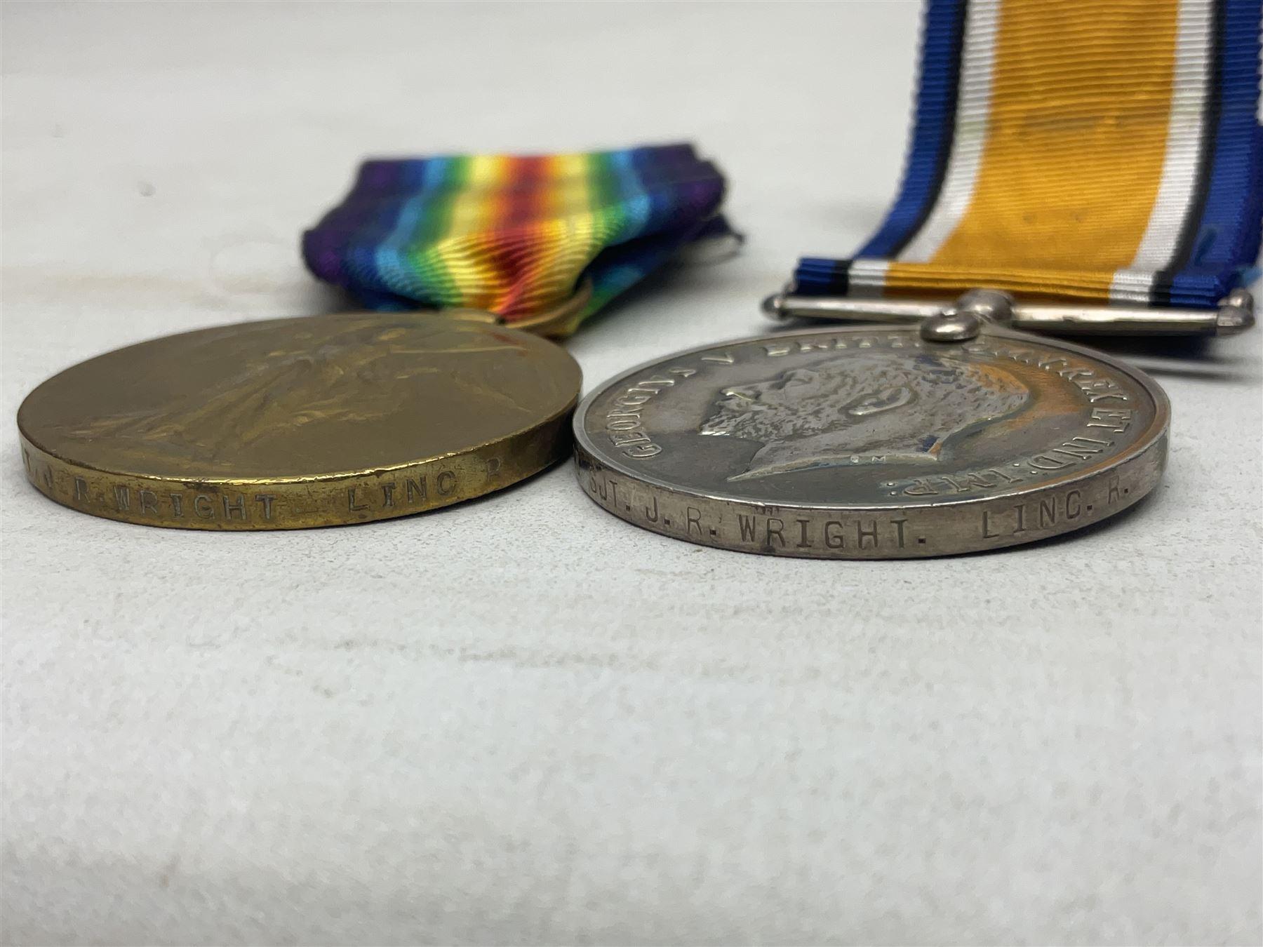 WW1 trio of medals comprising British War Medal, 1914-15 Star and Victory Medal awarded to 13708 Sjt. J.R. Wright Linc. R.; all with ribbons; some biographical details