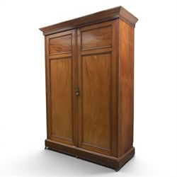 Edwardian walnut double wardrobe, fitted with two panelled doors, opening to reveal fitted interior with hanging space, three sliding linen trays and three drawers