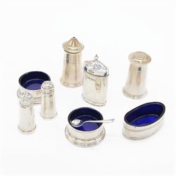 Group of silver cruet items, comprising pair of Art Deco salt and pepper shakers, of tapering cylindrical form, hallmarked Viner's Ltd, Sheffield 1933, pair of silver open salts, pair of salt shaker, and a matching pepper shaker and open salt, all hallmarked