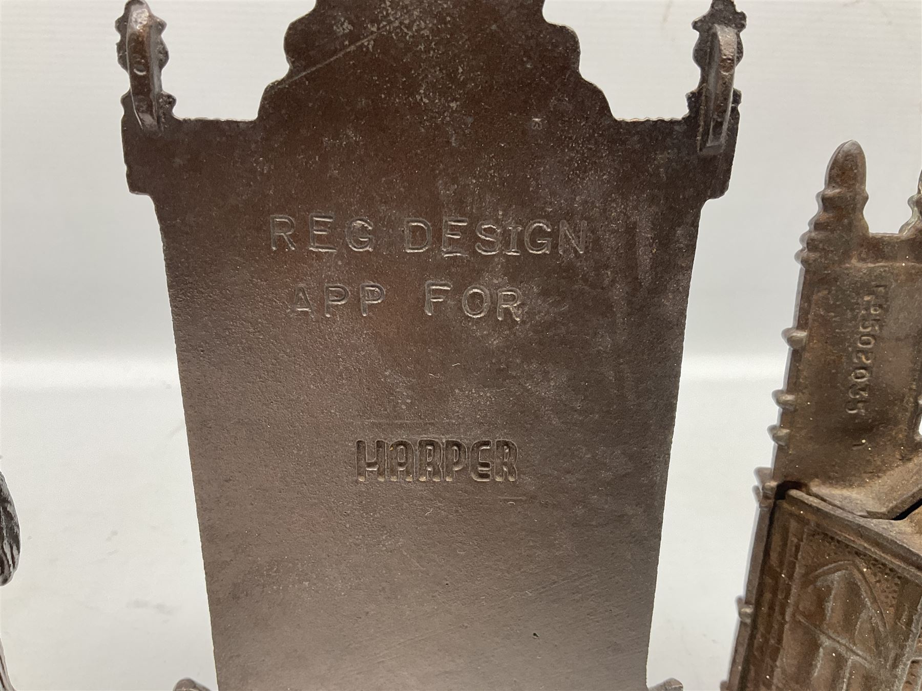 Four cast-iron money banks - 'Bear On Hind Legs bank' c1906 H16cm; 'ERII English Throne Bank' 1953 H21cm; both made by John Harper; 'Tally-Ho Bank' c1906 by Chamberlain & Hill H11.5cm; and 'Westminster Abbey Bank' c1908 by Sydenham & McCoustra H16cm (4)