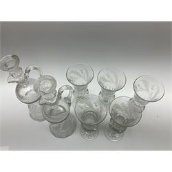 Pair of late 19th/early 20th century cut glass thistle shaped decanters and stoppers, together with a set of five thistle shaped drinking glasses, each with engraved thistle decoration, decanters H25cm, drinking glasses H18cm 
