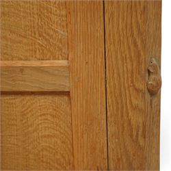 Mouseman - oak sideboard rectangular adzed top with raised back over three central drawers and two flanking cupboards, enclosed by panelled doors with wrought metal fixtures, the canted upright carved with mouse signature, on octagonal feet, by the workshop of Robert Thompson, Kilburn