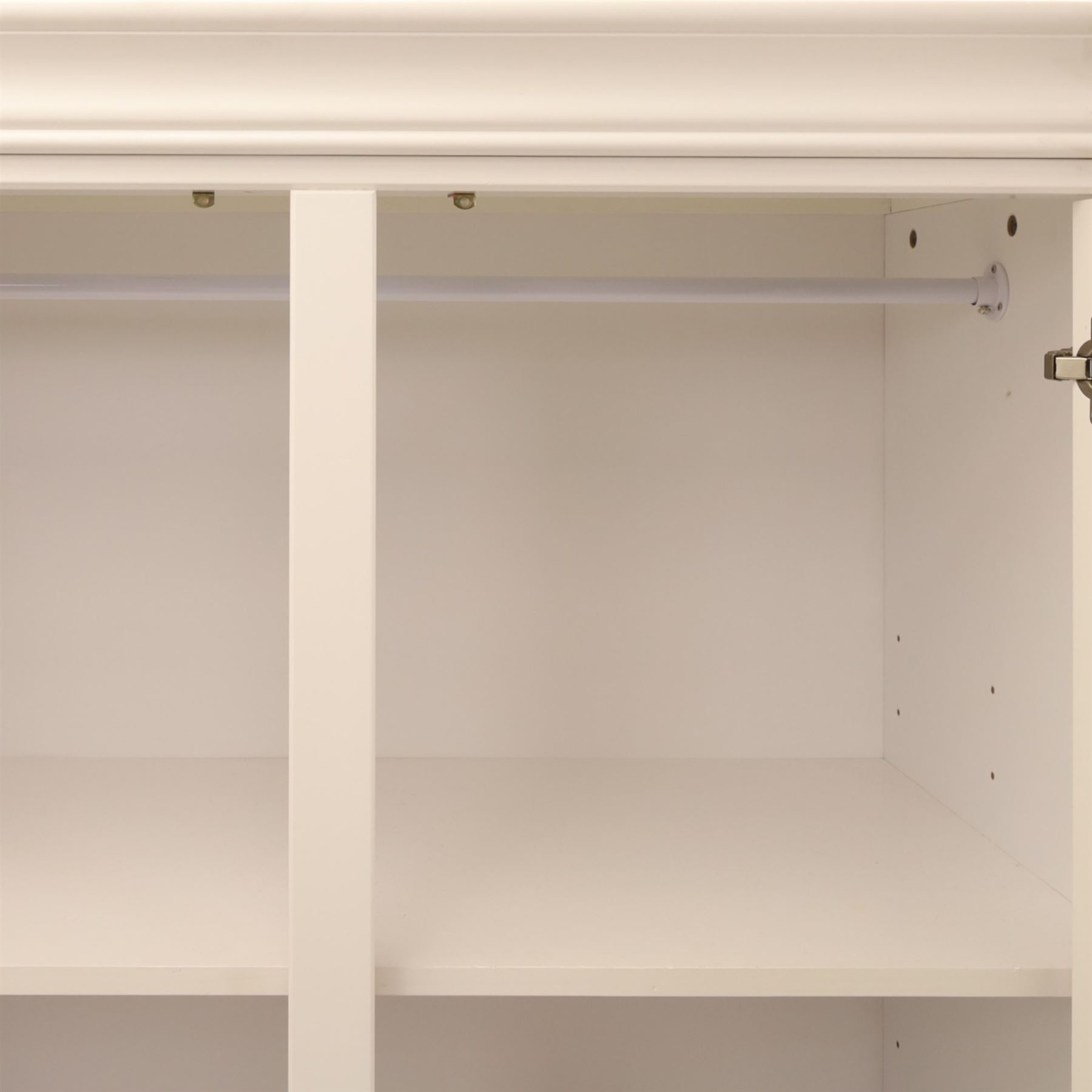 Modern white painted double wardrobe, fitted with two panelled doors, enclosing a hanging rail and shelving, raised on bracket feet