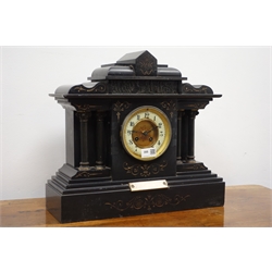  Victorian black slate architectural cased mantel clock with circular Arabic dial, twin train movement striking the half hours on a coil, H39cm  