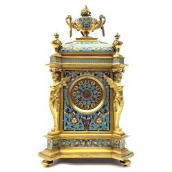 19th century French ormolu and champlevé enamel mantel clock, the twin handled urn with fruit and flower cast finial on cushion top, each corner set with urn, the front canted corners decorated with winged caryatid figures, turquoise ground champlevé work with scrolling floral pattern, twin train movement striking on bell by Japy Freres