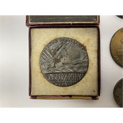 RMS Lusitania iron medallion dated 5th May, 5.5cm diameter, boxed with St Dunstan's Blinded Soldiers Profit paperwork; another unboxed similar Lusitania medallion; 30th Corps Alamein Cuxhaven medallion; Battle of Jutland 1916 silver memorial pendant; Navajo Code Talkers medallion 2000; and five other military related medallions