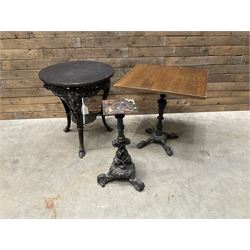 Cast iron Britannia circular pub table, and two pedestal cast iron bases (3)