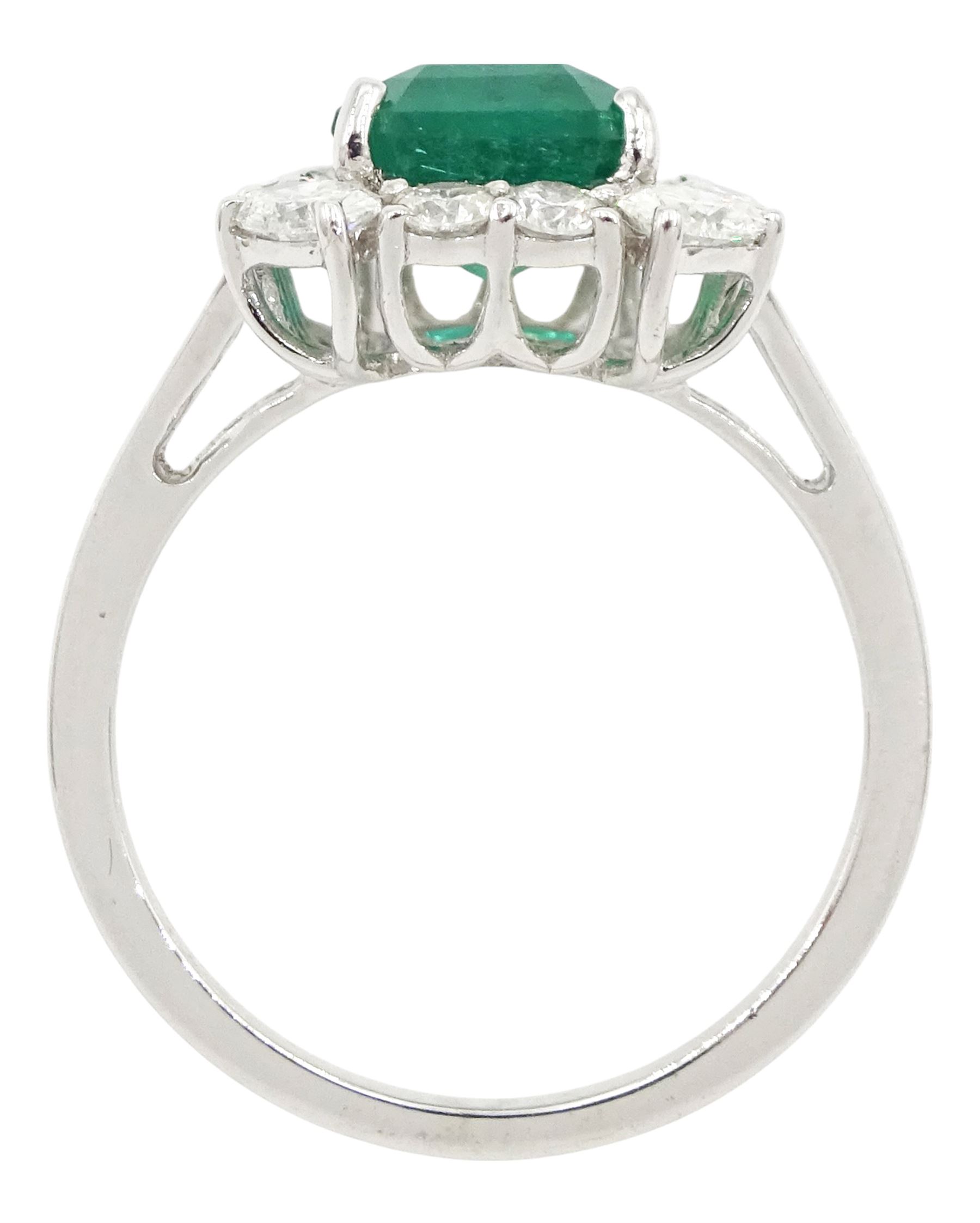 18ct white gold emerald and diamond cluster ring, single octagonal cut emerald of approx 2.90 carat, with oval cut diamonds set at each corner and round brilliant cut diamond surround, stamped, total diamond weight approx 0.90 carat