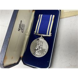 Archive of memorabilia and ephemera relating to Pc. (later Sgt.) Geoffrey Robinson of Dewsbury (later West Yorkshire) police force including cased Long Service and Good Conduct Medal; helmet plates and cap badges, collar numbers and uniform buttons, whistles, certificates, photographs, plaque etc 1960s - 1990s