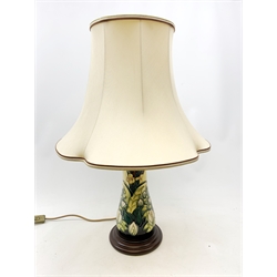 A large Moorcroft table lamp, decorated in the Lamia pattern, with bulrushes and water lilies, marks obscured by fixed stepped wooden base, including base and excluding shade H33.5cm.    