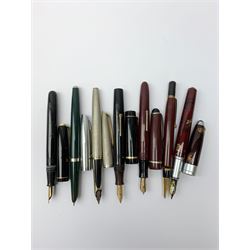 A Croxley Dickinson fountain pen, with black resin body, lever fill action and nib marked 14ct, together with two Waterman's pens, comprising a 502 with black resin body, lever fill action and nib marked 14ct, and an Argent Massif with engine turned decoration to body and nib marked 18K, an Osmiroid fountain pen with burgundy resin body and lever fill action, two further fountain pens, and a propelling pencil. (7). 